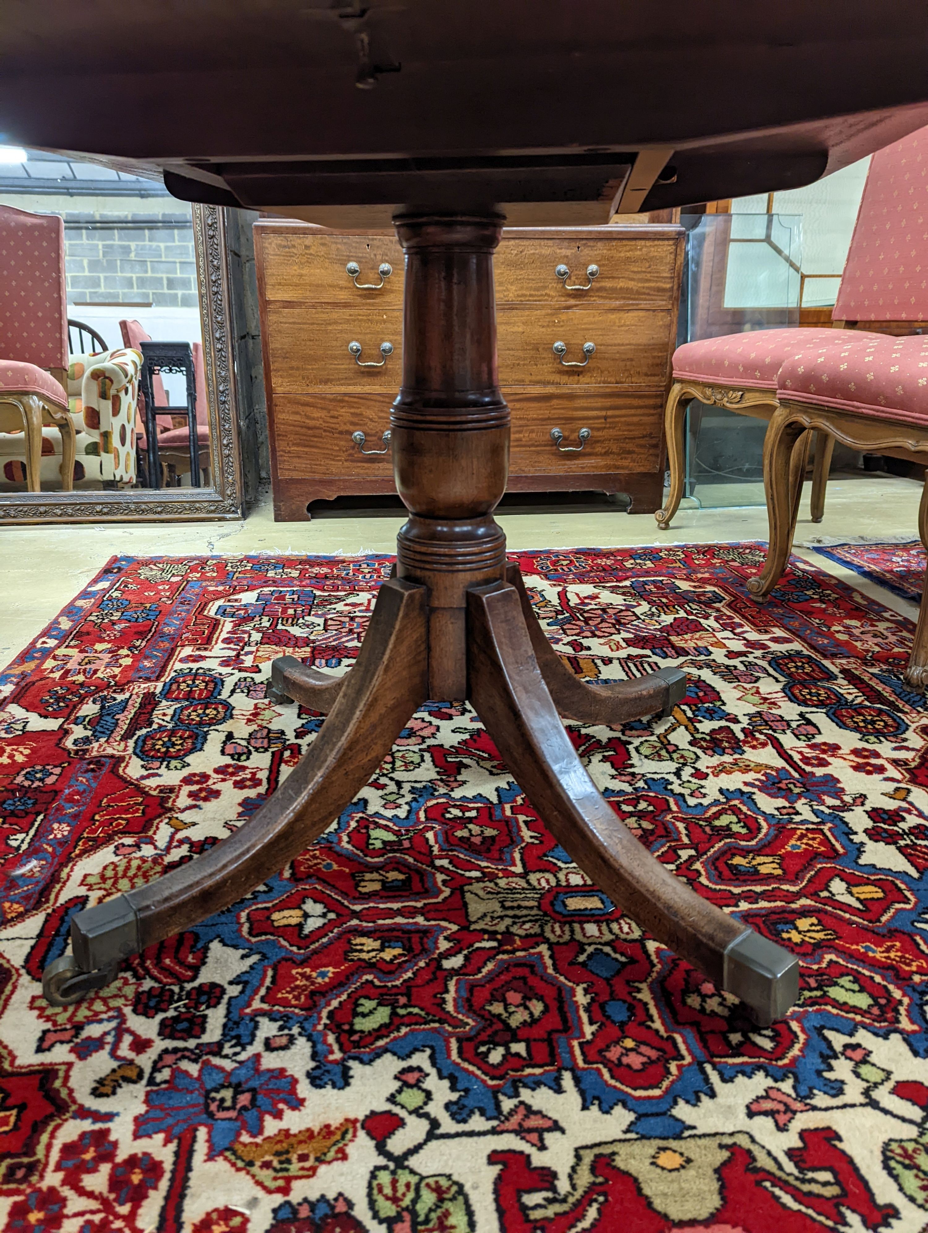 A Regency banded mahogany rectangular tilt top dining table, length 121cm, depth 82cm, height 71cm